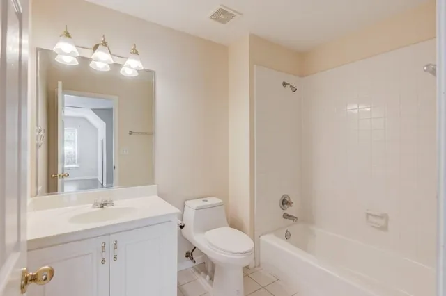 a kitchen with stainless steel appliances granite countertop a sink cabinets and wooden floor