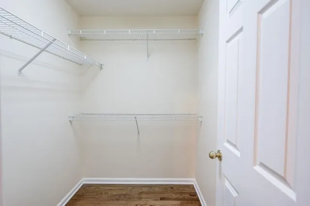 a kitchen with stainless steel appliances granite countertop a sink refrigerator and cabinets