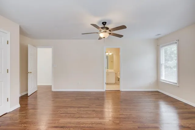 a open kitchen with a refrigerator a sink dishwasher and a fireplace with wooden floor