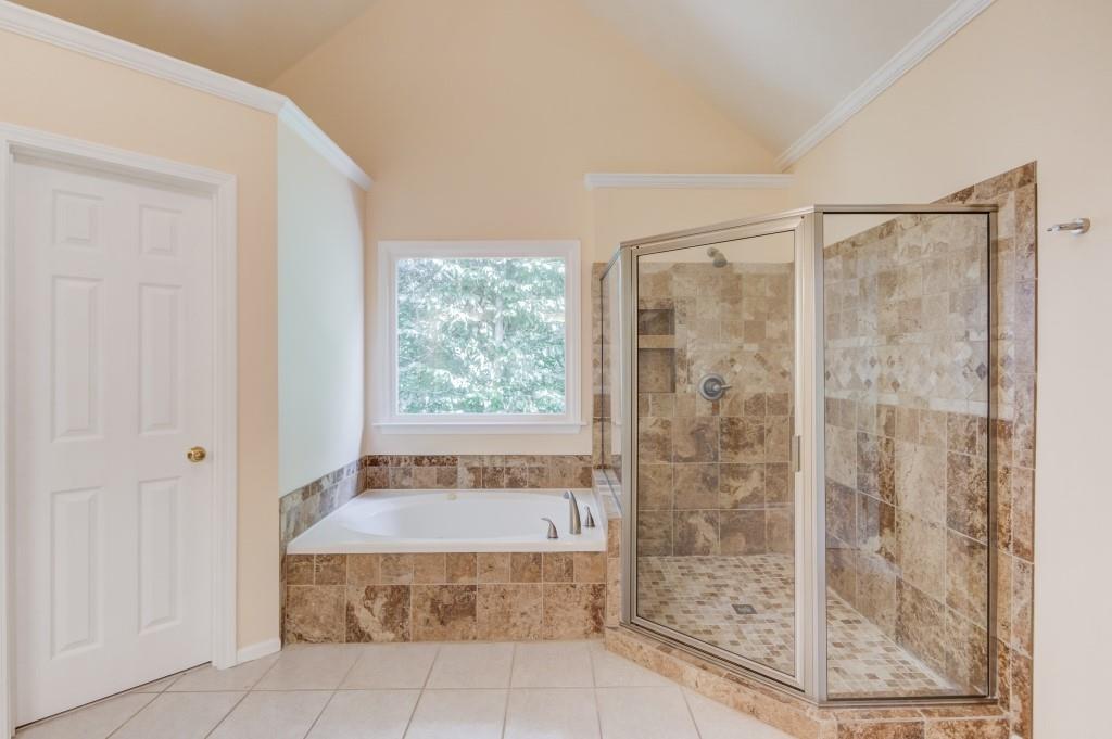 2405 Millwater Crossing Northeast Dacula, GA 30019 - Photo 38 of 63 a bathroom with a shower