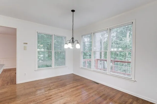 a view of a balcony with wooden floor