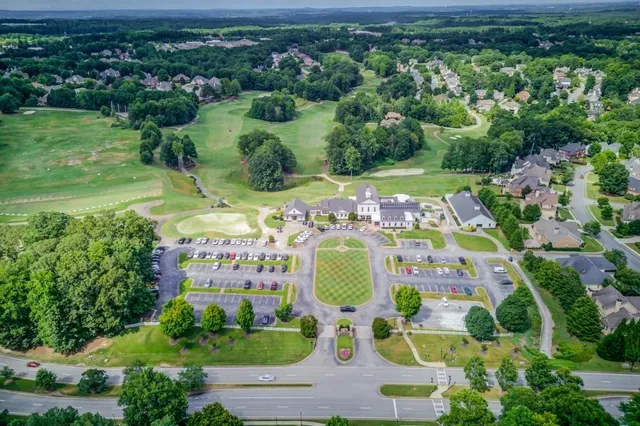 a view of a table and chairs in backyard of the house
