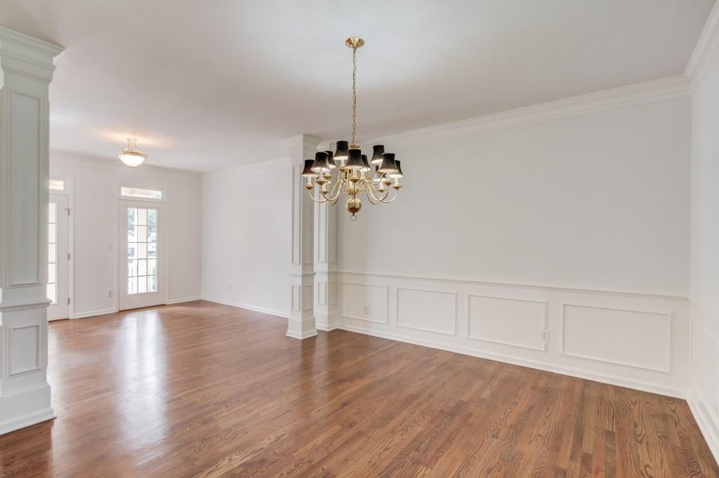 2405 Millwater Crossing Northeast Dacula, GA 30019 - Photo 54 of 63 a view of a room with wooden floor chandelier and window