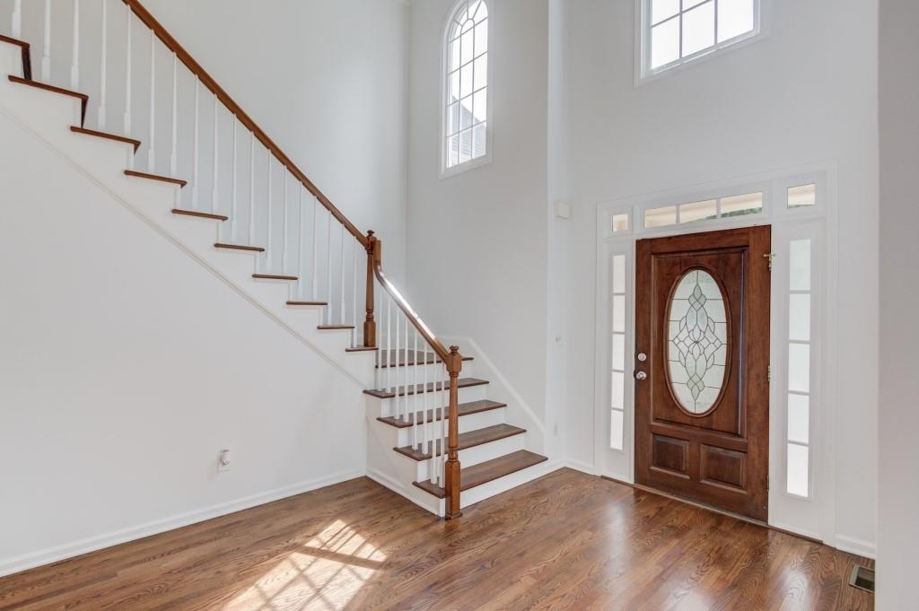 2405 Millwater Crossing Northeast Dacula, GA 30019 - Photo 58 of 63 a view of entryway with wooden floor and stair