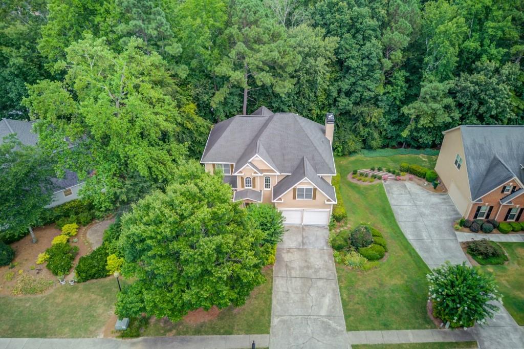 2405 Millwater Crossing Northeast Dacula, GA 30019 - Photo 60 of 63 an aerial view of a house with garden space and a street view