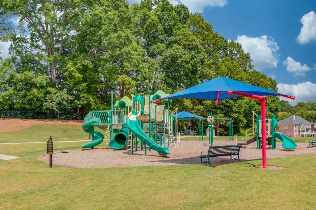 2405 Millwater Crossing Northeast Dacula, GA 30019 - Photo 6 of 63 a view of a park with slide