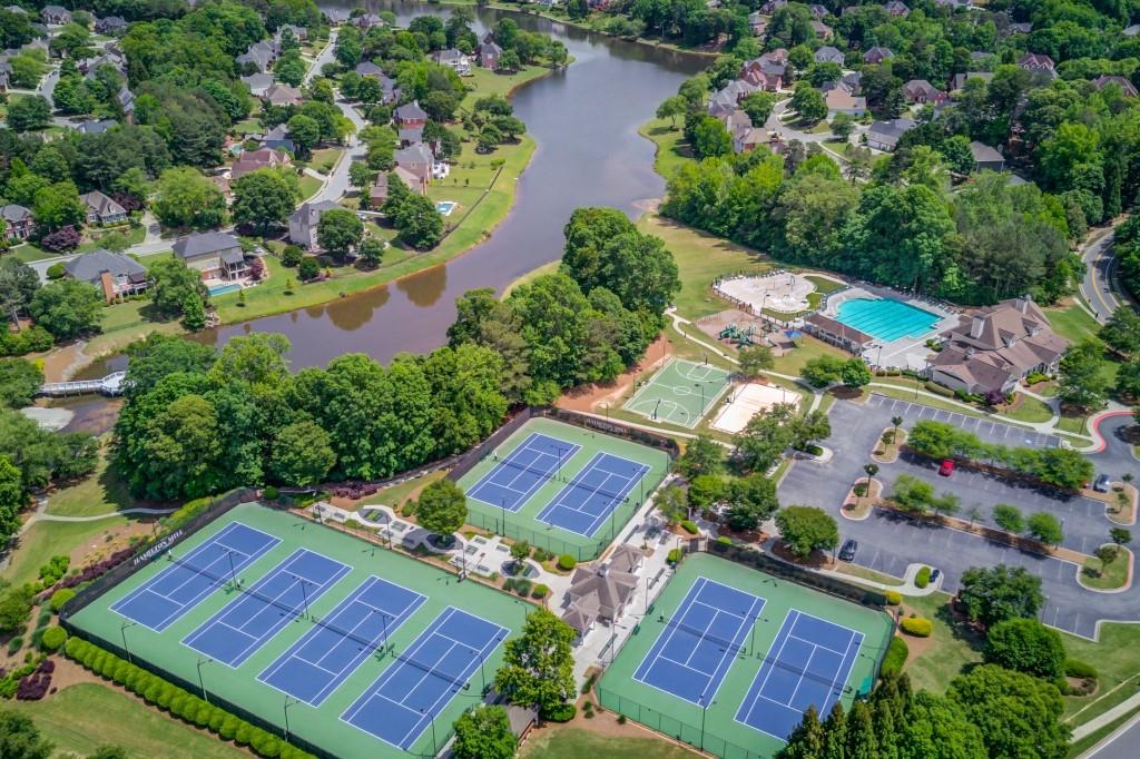 2405 Millwater Crossing Northeast Dacula, GA 30019 - Photo 9 of 63 an aerial view of a house with a garden