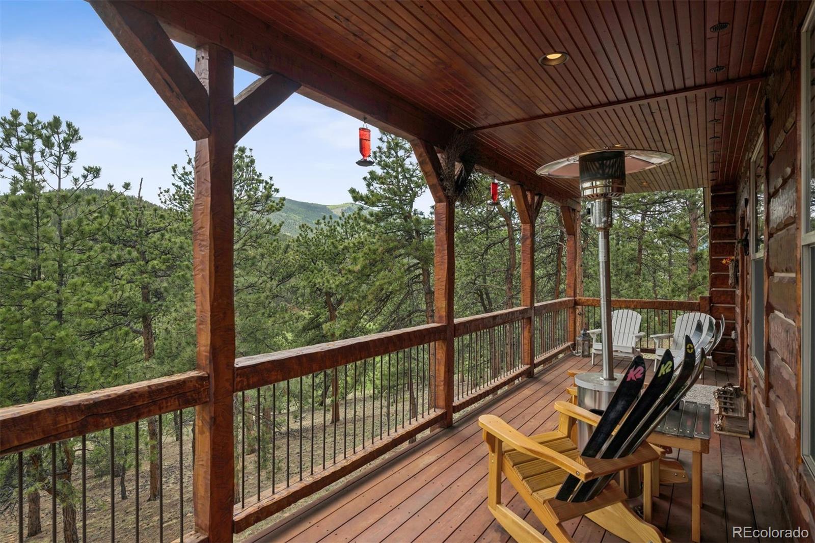 2894 County Road 43 Bailey, CO 80421 - Photo 39 of 40 a view of a balcony with chairs and wooden floor