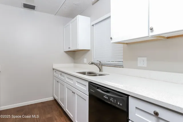 a view of an empty room with a fireplace
