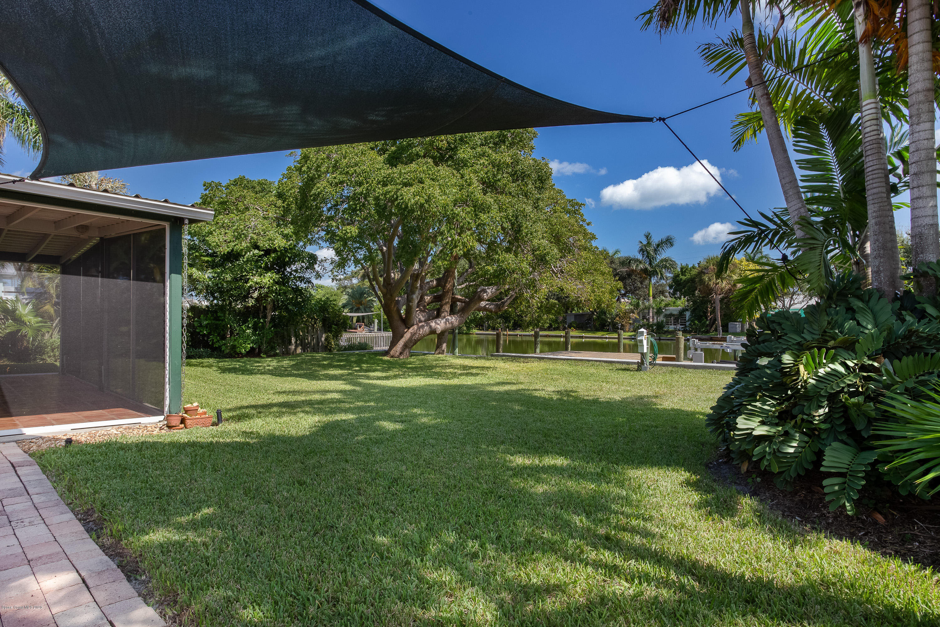 113 Aucila Road Cocoa Beach, FL 32931 - Photo 22 of 35 Partially Shaded Backyard