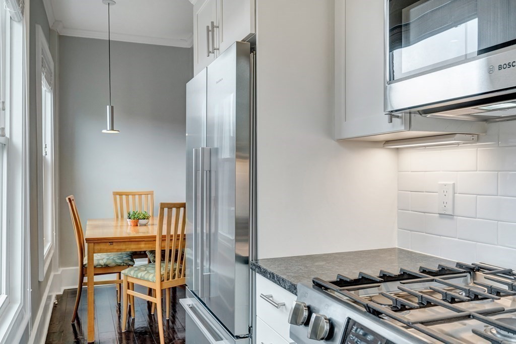 72 Rutland Street, Unit 3 Boston, MA 02118 - Photo 11 of 27 a kitchen with a stove and a refrigerator
