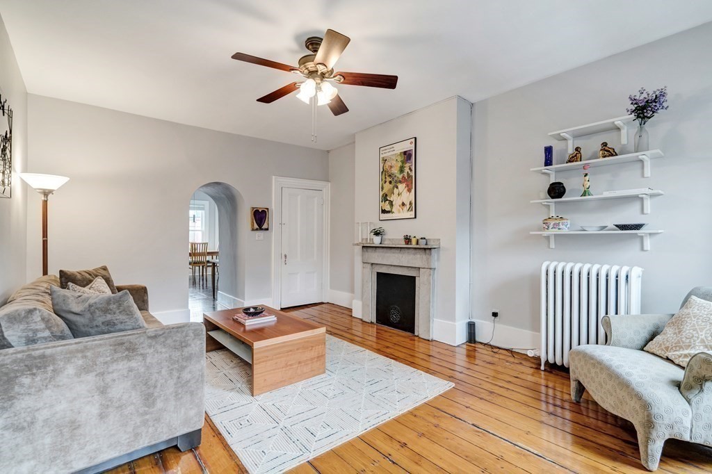72 Rutland Street, Unit 3 Boston, MA 02118 - Photo 17 of 27 a living room with furniture and a fireplace