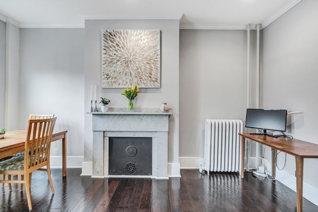 72 Rutland Street, Unit 3 Boston, MA 02118 - Photo 3 of 27 a living room with furniture and a fireplace