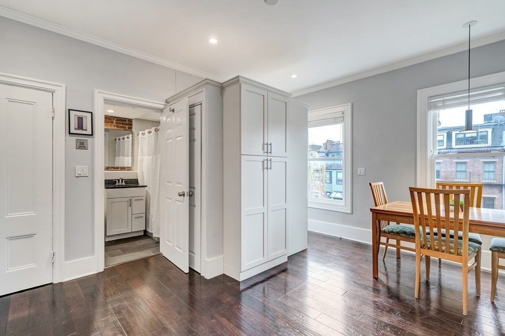 72 Rutland Street, Unit 3 Boston, MA 02118 - Photo 7 of 27 a view of kitchen with furniture and wooden floor