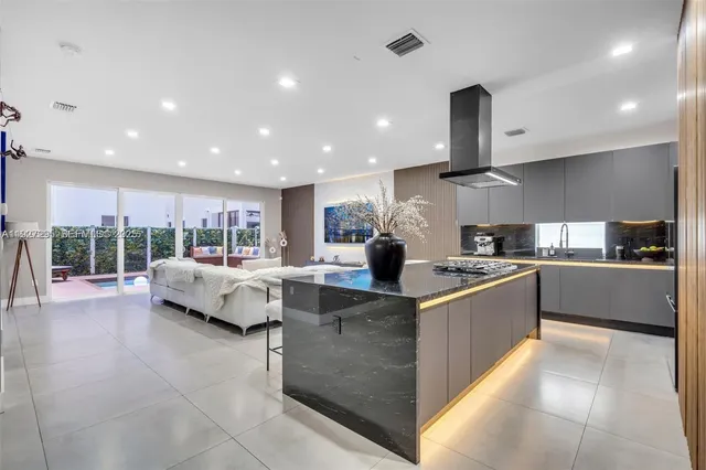 a large kitchen with stainless steel appliances lots of counter top space