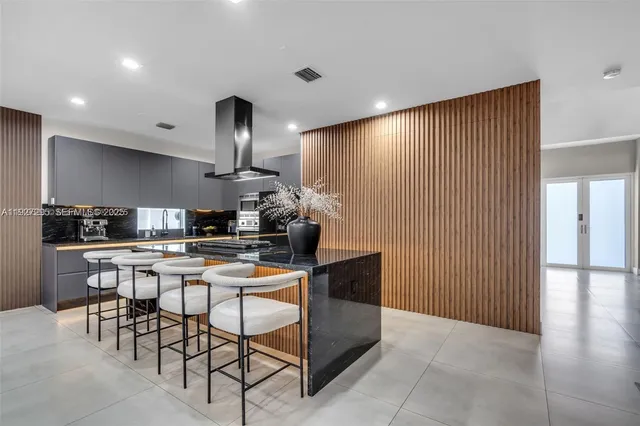 a kitchen with a table and chairs