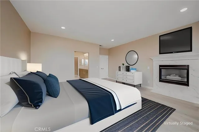 a view of an empty room with a window and a fireplace