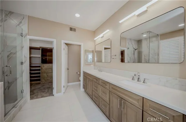 a spacious bathroom with a bathtub and a shower