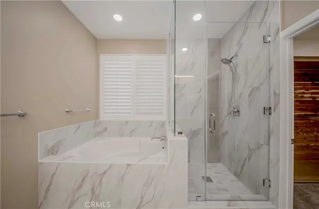 a bathroom with a granite countertop sink a toilet and a mirror