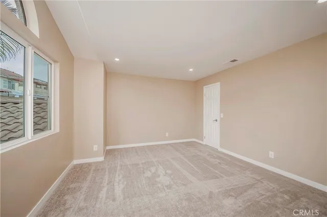 a spacious bathroom with a shower sink double vanity granite tub and a mirror