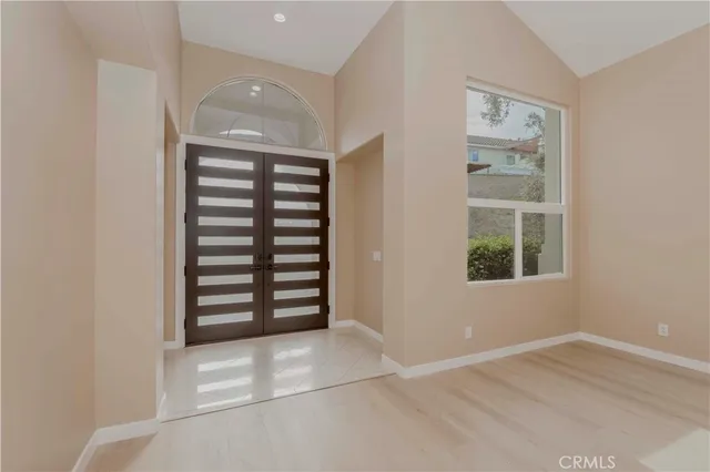 an empty room with windows and closet