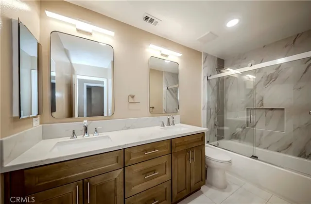 a view of an empty room with a staircase