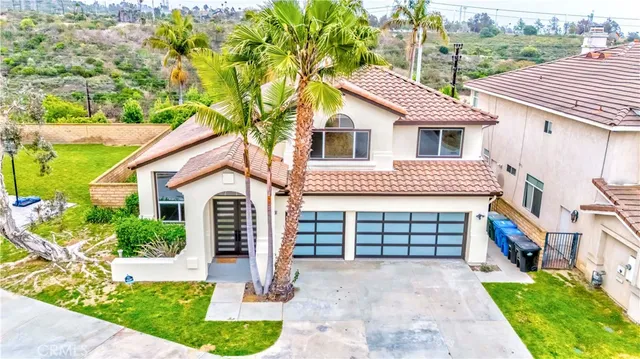 aerial view of a swimming pool with a yard
