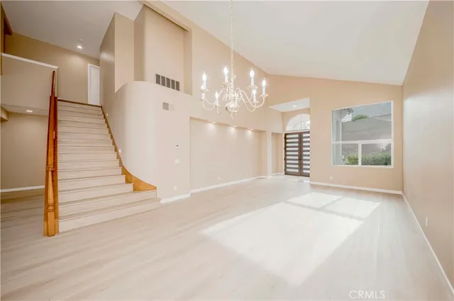 a view of entryway and hall with a front door