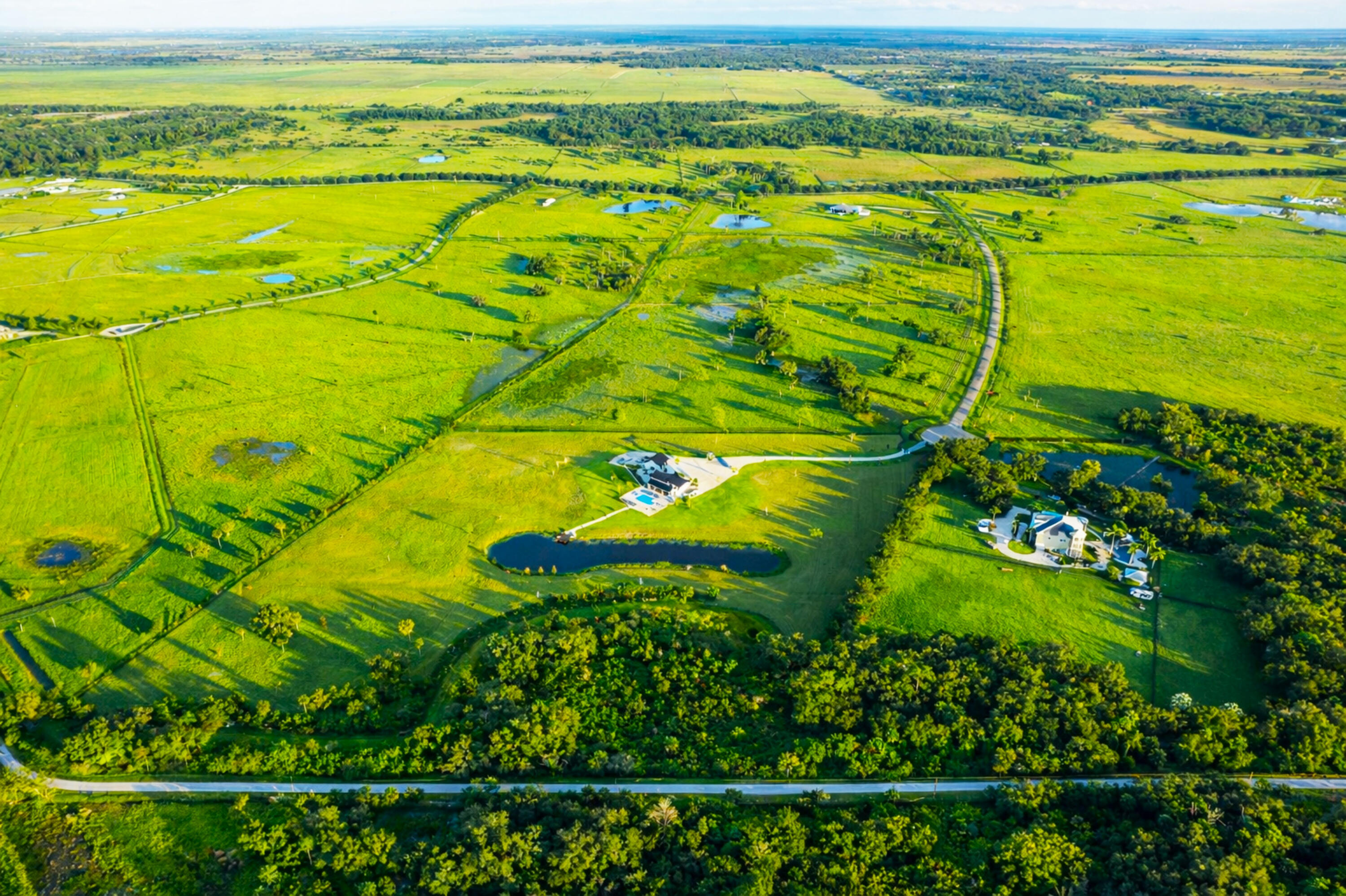 26209 Southwest Jockeys Run Okeechobee, FL 34974 - Photo 55 of 57 Rural morning glow with ponds