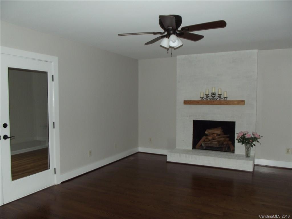 10503 Fairway Ridge Road Charlotte, NC 28277 - Photo 14 of 28 a living room with a fireplace