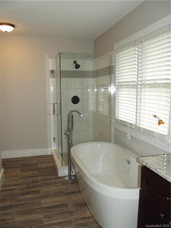 10503 Fairway Ridge Road Charlotte, NC 28277 - Photo 22 of 28 a bathroom with a bathtub and a shower