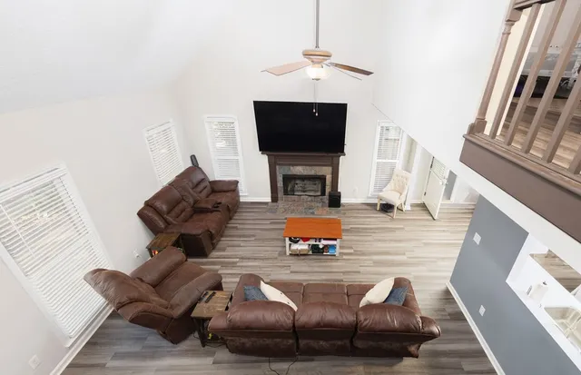 a living room with furniture fireplace and a flat screen tv