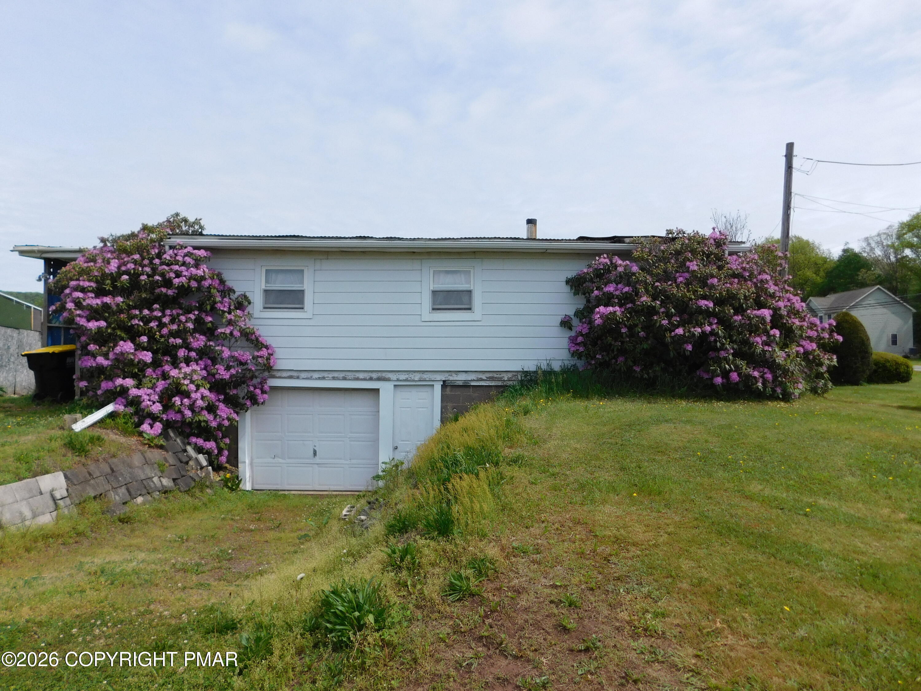 3551 Quakake Road Weatherly, PA 18255 - Photo 1 of 8 a front view of a house with garden
