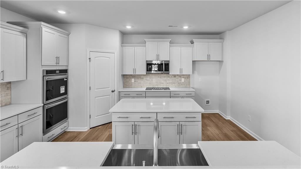 3000 Bayou Street Graham, NC 27253 - Photo 17 of 39 Built In Ovens and Vented Microwave to Exterior