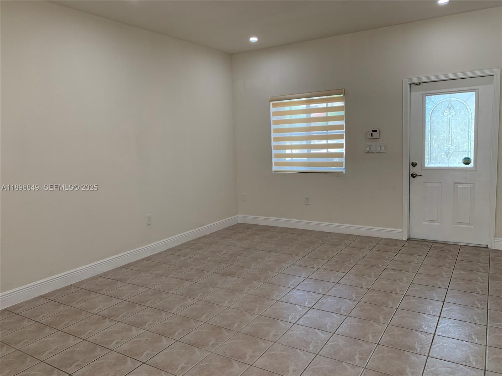 14179 Southwest 126th Place Miami, FL 33186 - Photo 9 of 26 an empty room with windows