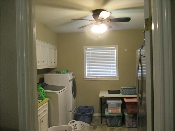 a kitchen with a refrigerator and countertop
