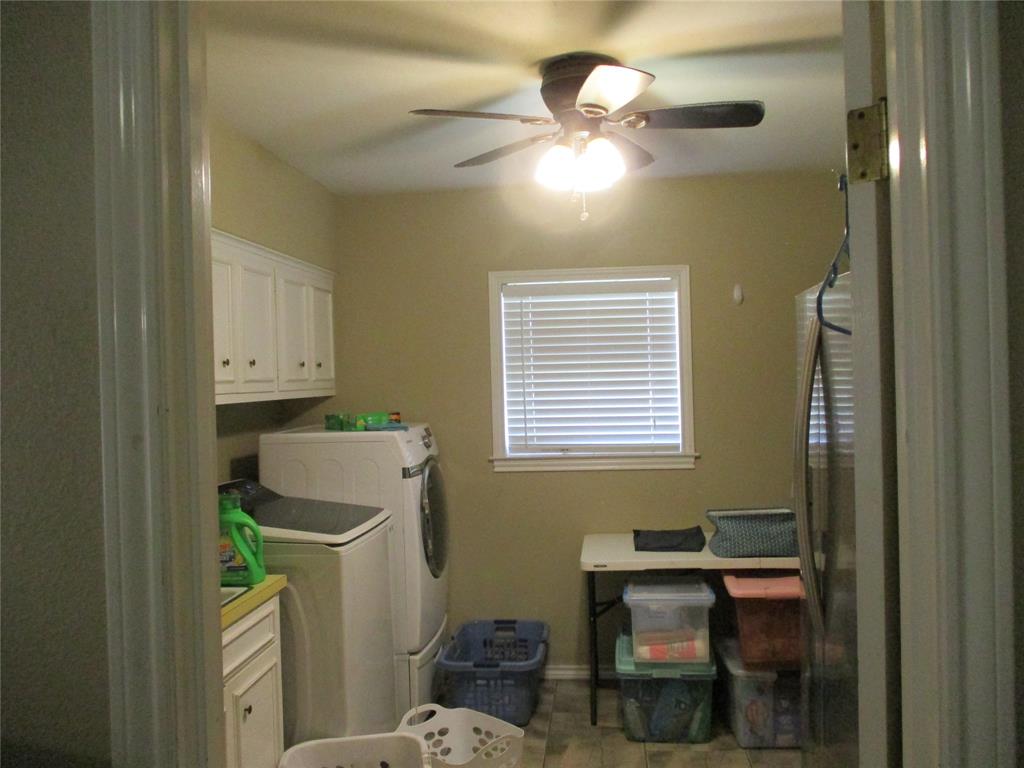 235 Industrial Point Point, TX 75472 - Photo 15 of 34 a bathroom with a sink a toilet and vanity