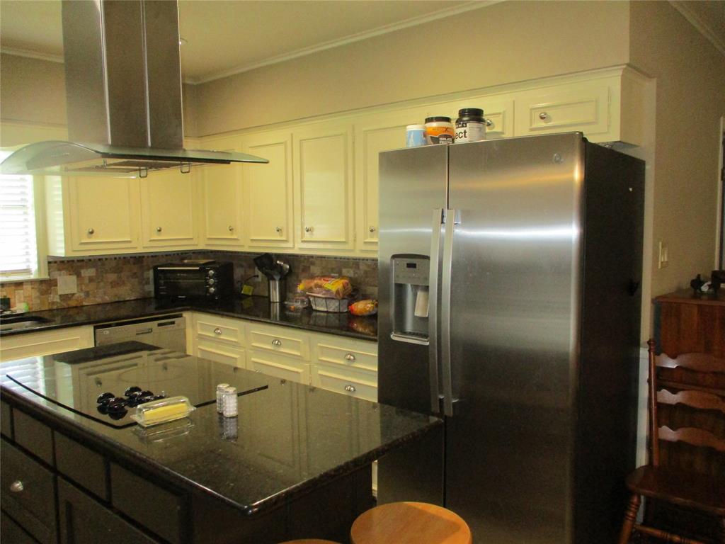 235 Industrial Point Point, TX 75472 - Photo 17 of 34 a kitchen with a refrigerator and countertop