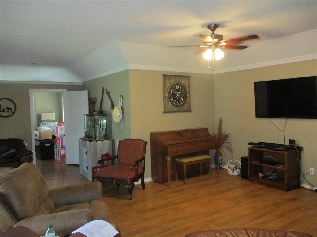 235 Industrial Point Point, TX 75472 - Photo 20 of 34 a living room with furniture and a flat screen tv