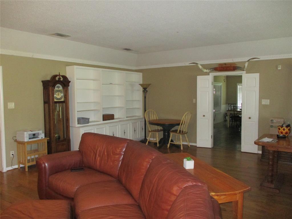 235 Industrial Point Point, TX 75472 - Photo 23 of 34 a living room with furniture and a wooden floor