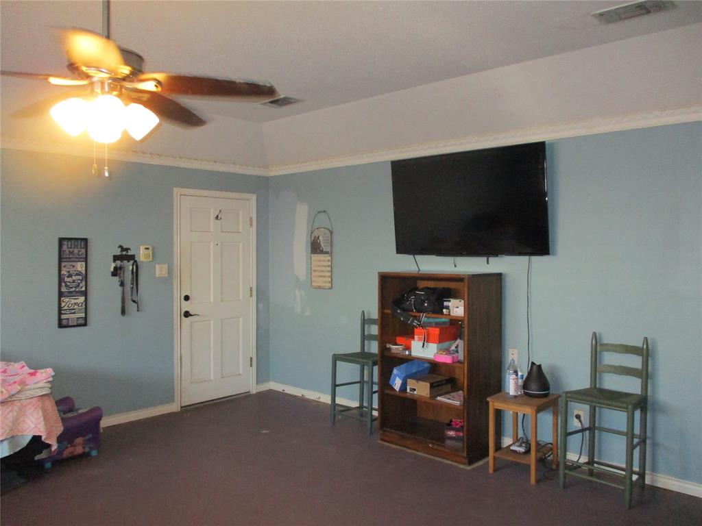 235 Industrial Point Point, TX 75472 - Photo 32 of 34 a living room with furniture and a flat screen tv