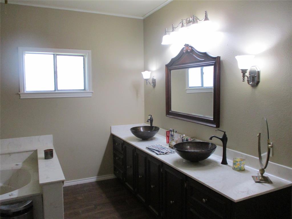235 Industrial Point Point, TX 75472 - Photo 33 of 34 a bathroom with a sink and a mirror