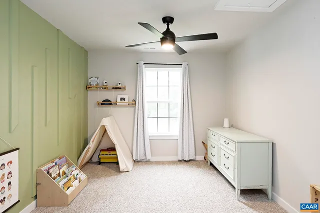 a view of room with windows and cabinet