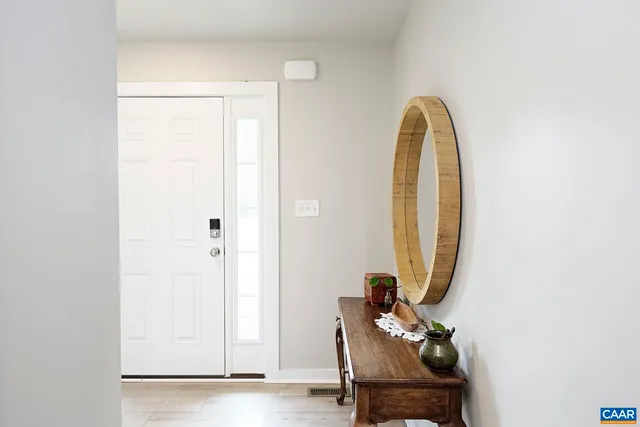 a view of a room with a furniture and a mirror