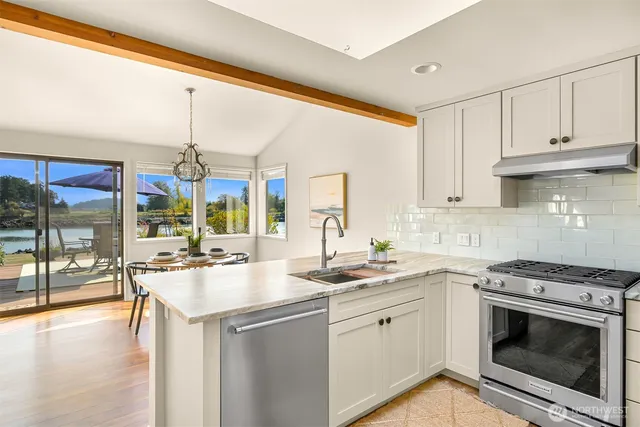 a kitchen with a sink stove and cabinets
