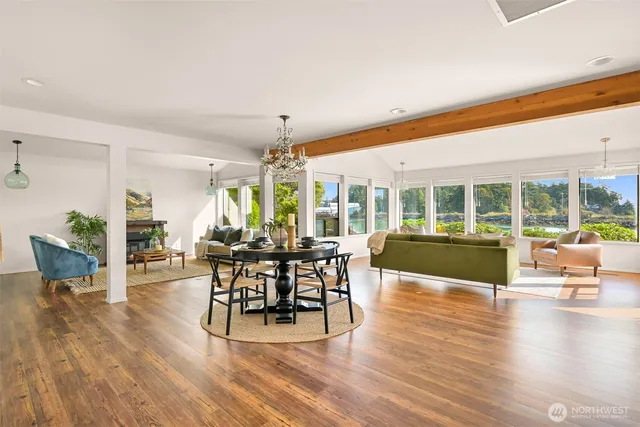a view of a dining room with furniture window and wooden floor