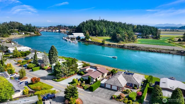 an aerial view of a house with a lake view