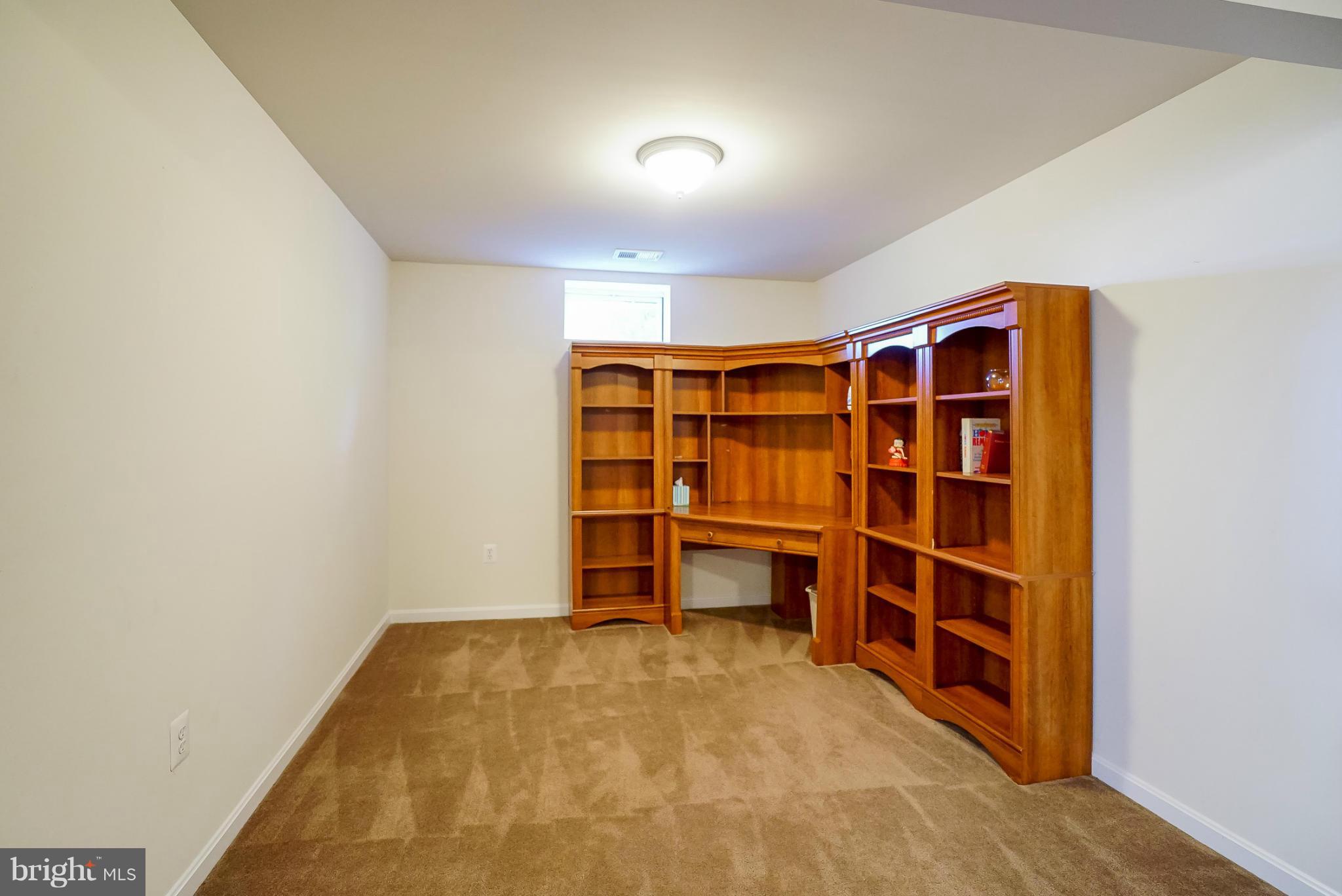 4238 Meyers Road Triangle, VA 22172 - Photo 22 of 29 a view of an empty room with empty shelves