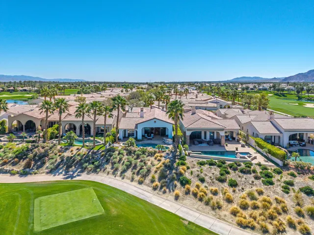 a living room with furniture and a clock