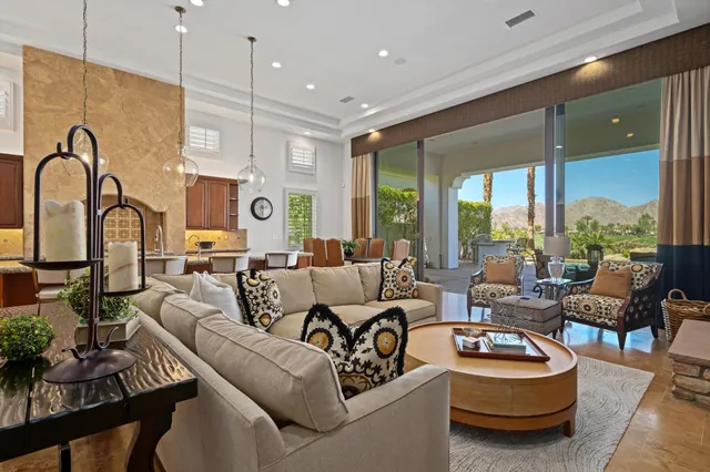 a kitchen with stainless steel appliances granite countertop a sink a stove and cabinets